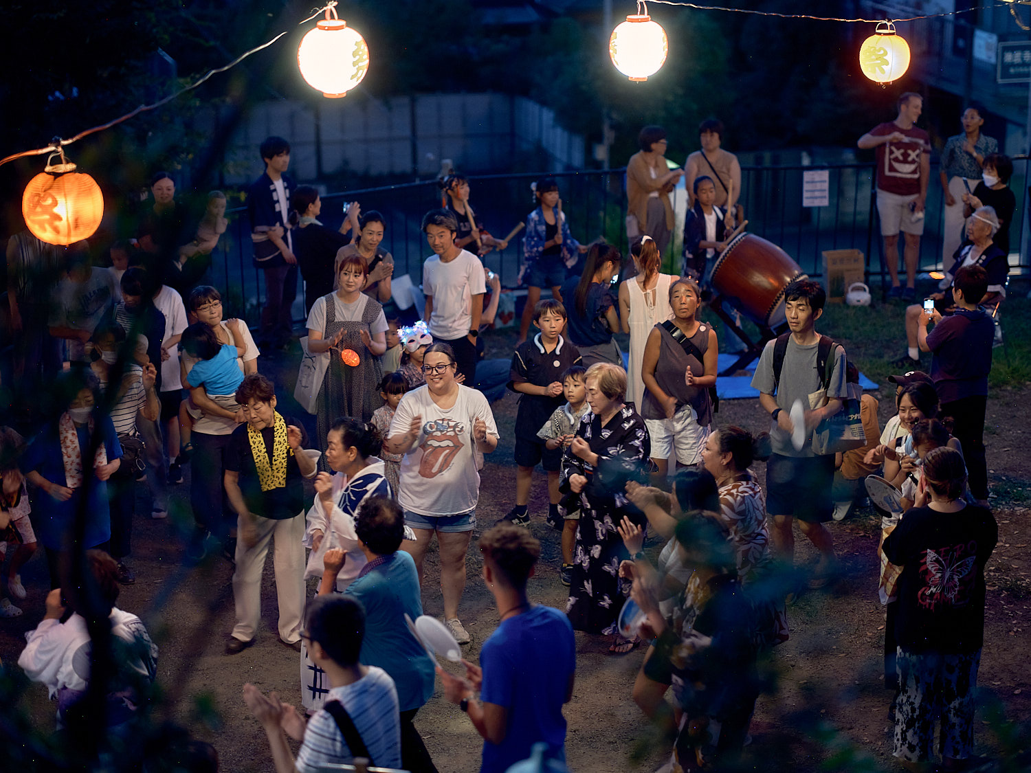 Commander, Fleet Activities Yokosuka community members participate in a Bon Odori at Ikego Shinmeisha Shrine across the street from Ikego Heights Family Housing August 3, 2024 in Zushi, Japan.