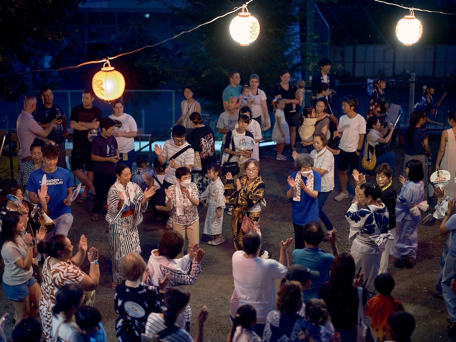 Commander, Fleet Activities Yokosuka community members participate in a Bon Odori at Ikego Shinmeisha Shrine across the street from Ikego Heights Family Housing August 3, 2024 in Zushi, Japan.