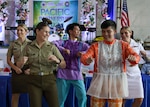 LEGAZPI, Philippines (Aug. 2, 2024.) - Australian Army Lt. Chloe Apps, left, Australian Army Capt. Louise Macinnes, middle, and U.S. Navy Lt. Summer Combs, dance with Filipino locals during the opening ceremony at the Legazpi Expo Center in Legazpi, Philippines, Aug. 2, 2024. During this mission stop, U.S. servicemembers will work with the ally and partner nations of Australia, U.K. Singapore, the Republic of Korea and the Philippines, to Forster multilateral cooperation focusing on four lines of effort; humanitarian assistance and disaster relief, host nation outreach events, engineering and medical. Now in its 20th iteration, the Pacific Partnership series is the largest annual multinational humanitarian assistance and disaster relief preparedness mission conducted in the Indo-Pacific. Pacific Partnership works collaboratively with host and partner nations to enhance regional interoperability and disaster response capabilities, increase security and stability in the region, and foster new and enduring friendships in the Indo-Pacific. (U.S. Navy photo by Mass Communication Specialist Seaman Gavin Arnoldhendershot)