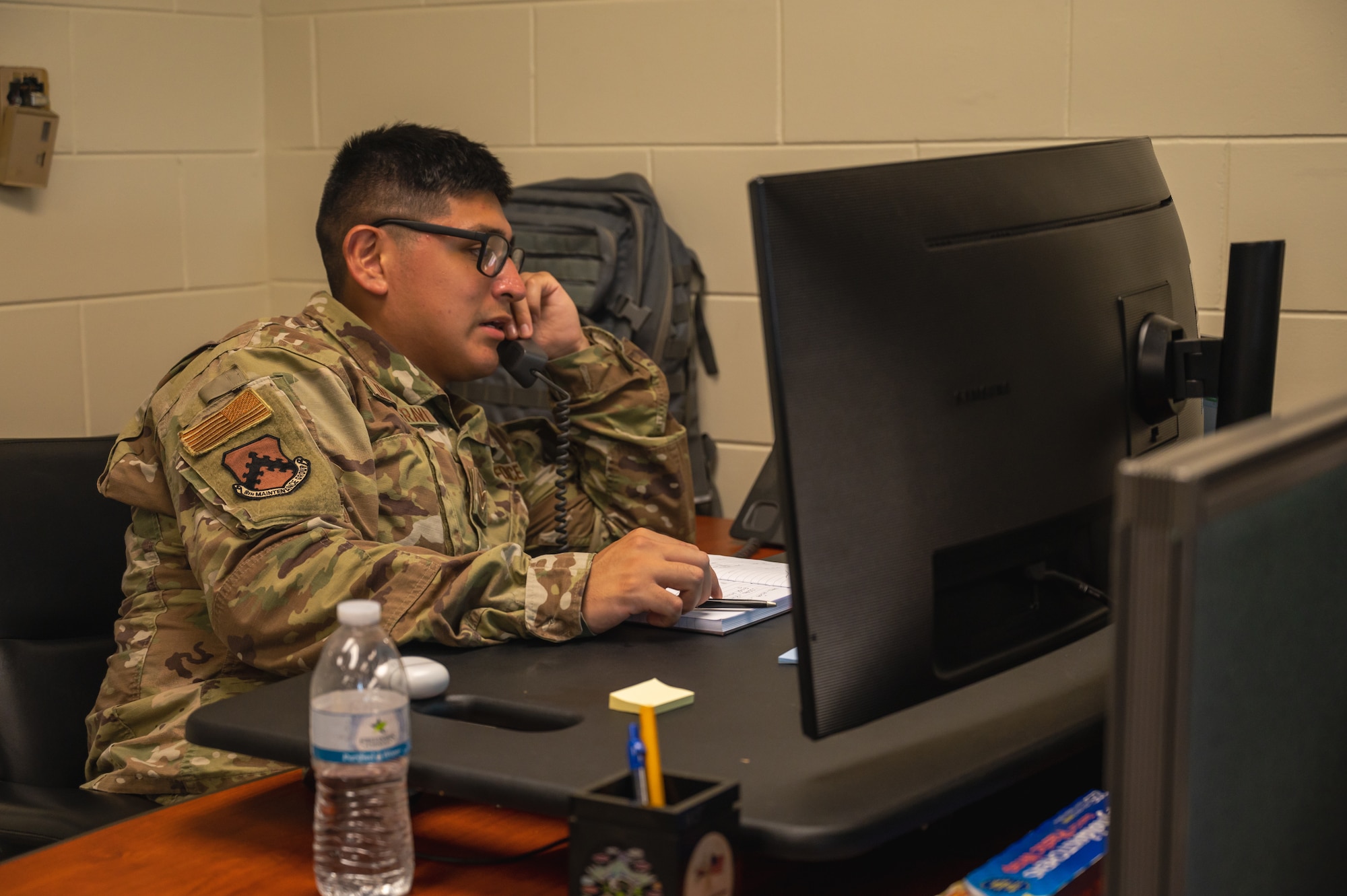 Senior Airman Gino Tapia Maravi, 8th Maintenance Group time compliance technical order monitor, confirms scheduling information.