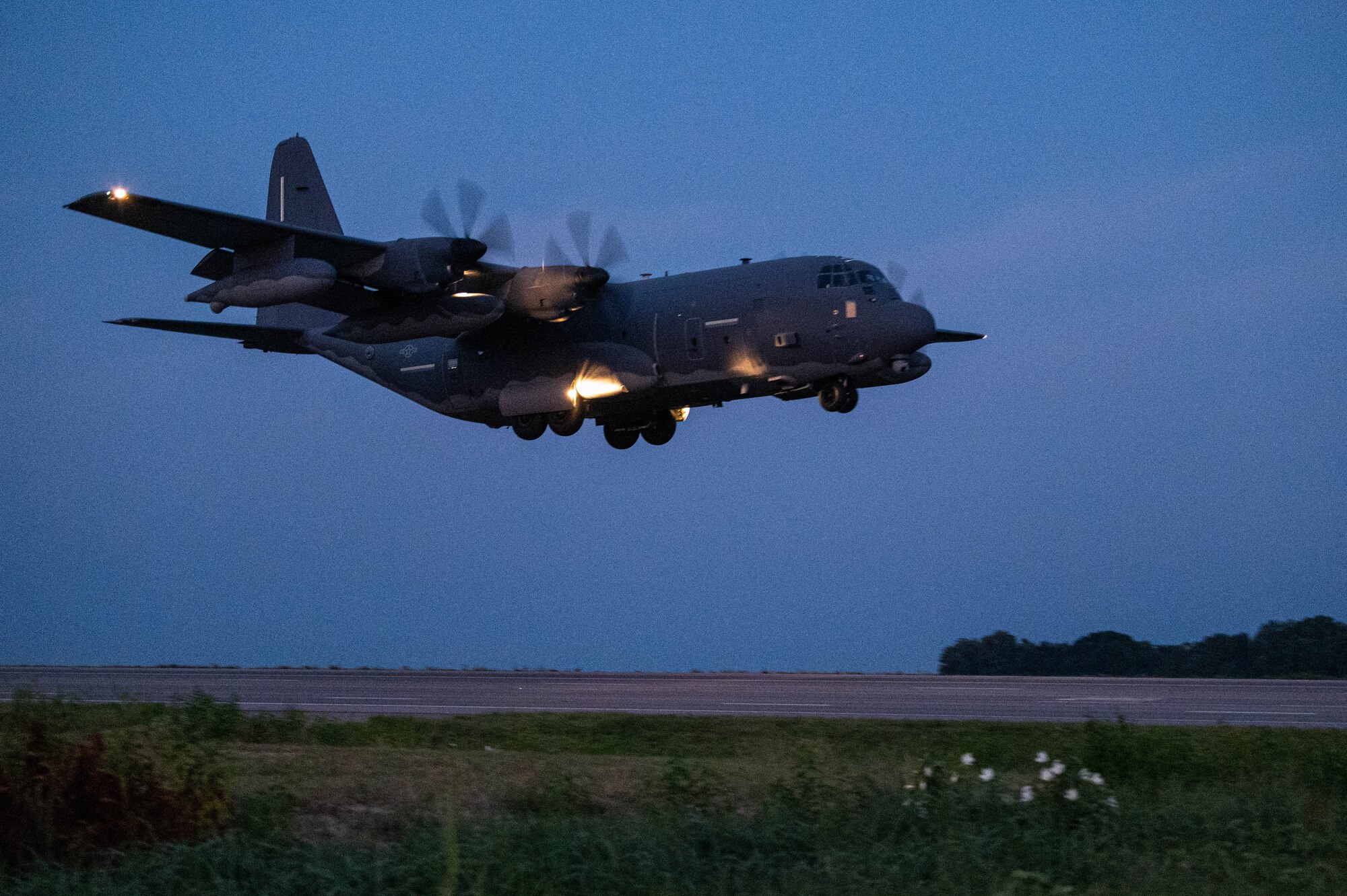 A U.S. Air Force MC-130J Commando II, assigned to the 492nd Special Operations Wing, lands on Highway 63 during Emerald Warrior 24 FTX II in Bono, Arkansas, August 4, 2024.