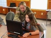 U.S. Soldiers with the Pennsylvania National Guard Cyber Branch host 13 students aged 11-18 from the Pequea Valley School District Apple Core Team for a day of learning and competition at Fort Indiantown Gap, Pennsylvania, Aug.1, 2024.