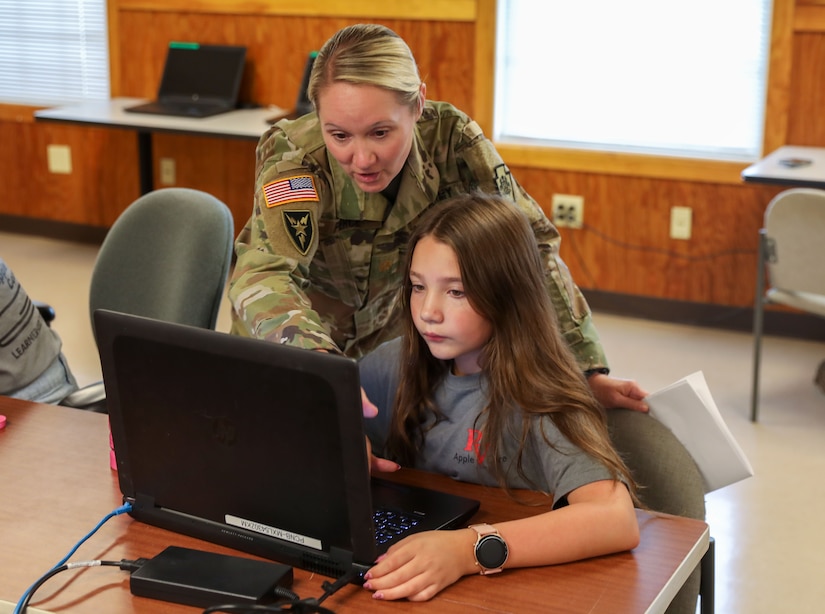 U.S. Soldiers with the Pennsylvania National Guard Cyber Branch host 13 students aged 11-18 from the Pequea Valley School District Apple Core Team for a day of learning and competition at Fort Indiantown Gap, Pennsylvania, Aug.1, 2024.