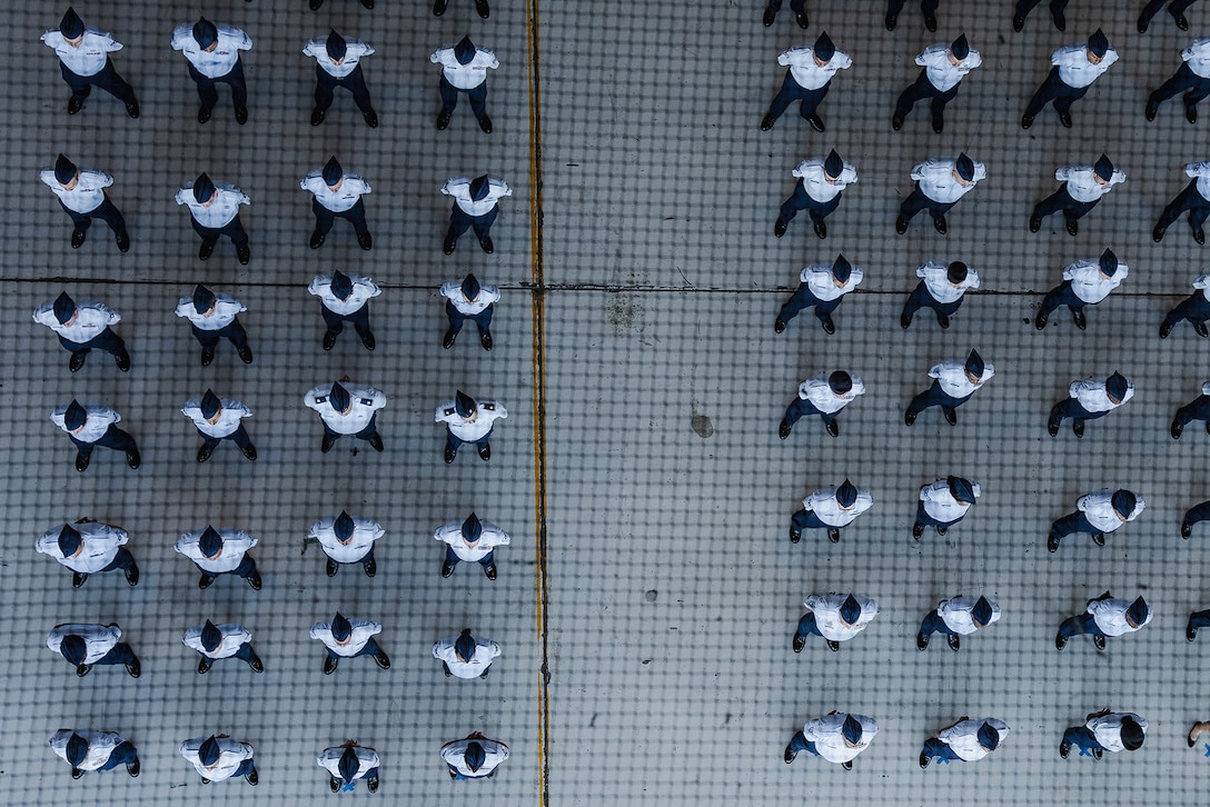 Aerial view of a group of airmen standing in formation.