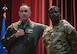 U.S. Air Force Col. Jesse Lamarand, 5th Bomb Wing (BW) commander (left), and Chief Master Sgt. Wayne Sharp, 5th BW command chief (right), host their inaugural 5th BW all-call at Minot Air Force Base, North Dakota, July 30, 2024. During the all-call, the team introduced themselves, their leadership philosophies, and their goals for their time at Minot AFB. (U.S. Air Force photo by Airman 1st Class Alyssa Bankston)