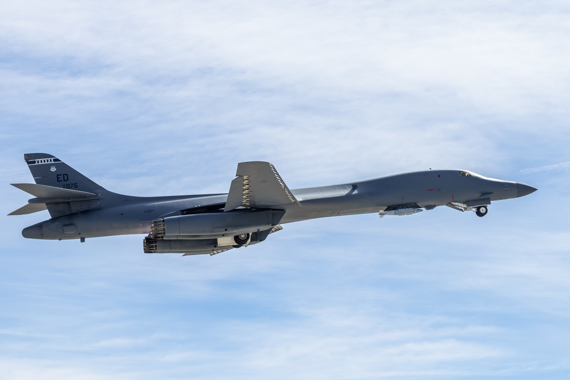 A B-1B Lancer assigned to the 419th Flight Test Squadron takes off from Edwards Air Force Base, California, Feb. 15, to conduct flight tests on the Load Adaptable Modular pylon. (Air Force photo by James West)