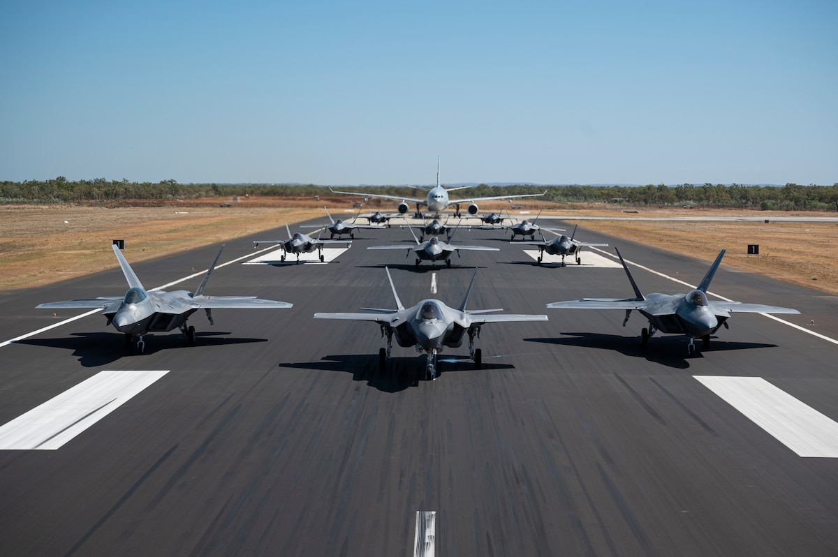 U.S. Air Force F-22A Raptors assigned to the 27th Expeditionary Fighter Squadron along with Royal Australian Air Force F-35A Lightning IIs from No 75 Squadron and a KC-30A Multi Role Tanker Transport aircraft from No. 33 Squadron, demonstrate a show of force by conducting an elephant walk at RAAF Base Tindal, Australia, July 31, 2024.