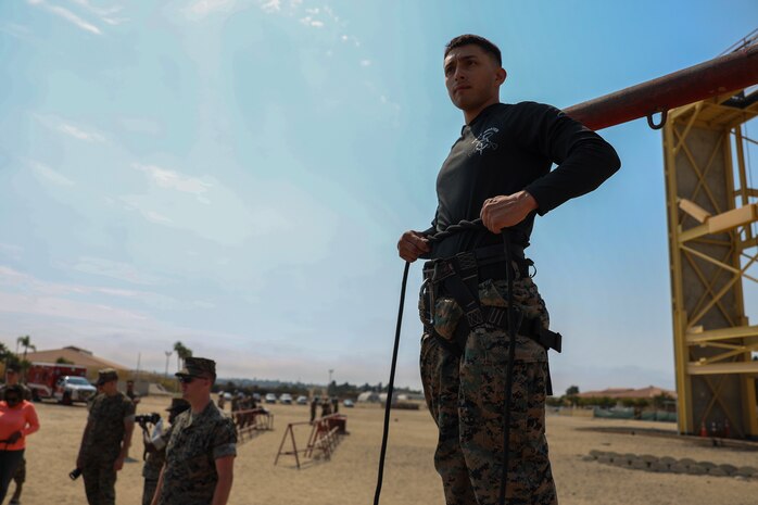 Educators from 12th Marine Corps District participate in a repelling class during an Educators Workshop event at Marine Corps Recruit Depot San Diego in San Diego, July 11, 2024. The Educators Workshop program provides selected educators and influential community members with an experiential opportunity to see how the Marine Corps transforms young men and women into Marines. The workshop also provides attendees with current information regarding Marine Corps training practices, military job skills, service opportunities, military lifestyle, and educational benefits available to Marines. (U.S. Marine Corps photo by Cpl. Israel Ballaro)
