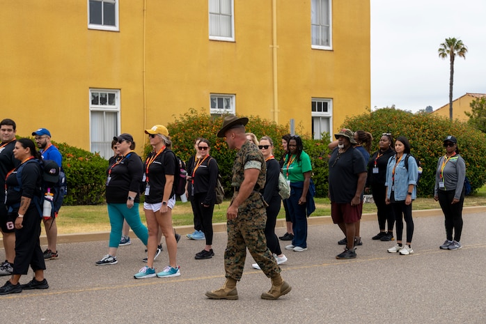 U.S. Marine Corps Staff Sgt. Jacob Smartnick, a drill instructor with 1st Recruit Training Battalion, Recruit Training Regiment, teaches drill movements to educators with Recruiting Stations’ Chicago, Indianapolis, Oklahoma City, and St. Louis during the 2024 Educators' Workshop at Marine Corps Recruit Depot San Diego, Calif., July 16, 2024. Participants visited MCRD San Diego to observe recruit training and gain a better understanding about the transformation from recruits to United States Marines. Educators also received classes and briefs on the benefits that are provided to service members serving in the U.S. Armed Forces. (U.S. Marine Corps photo by Sgt. Lennon Dregoiw)