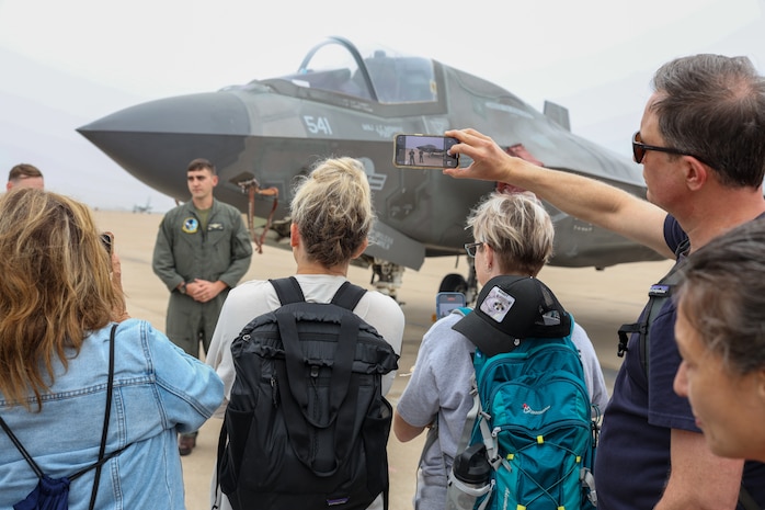 Educators view and photograph a static display during an Educators Workshop event at Marine Corps Air Station Miramar in Miramar, Calif., July 11, 2024. The Educators Workshop program provides selected educators and influential community members with an experiential opportunity to see how the Marine Corps transforms young men and women into Marines. The workshop also provides attendees with current information regarding Marine Corps training practices, military job skills, service opportunities, military lifestyle, and educational benefits available to Marines. (U.S. Marine Corps photo by Cpl. Israel Ballaro)