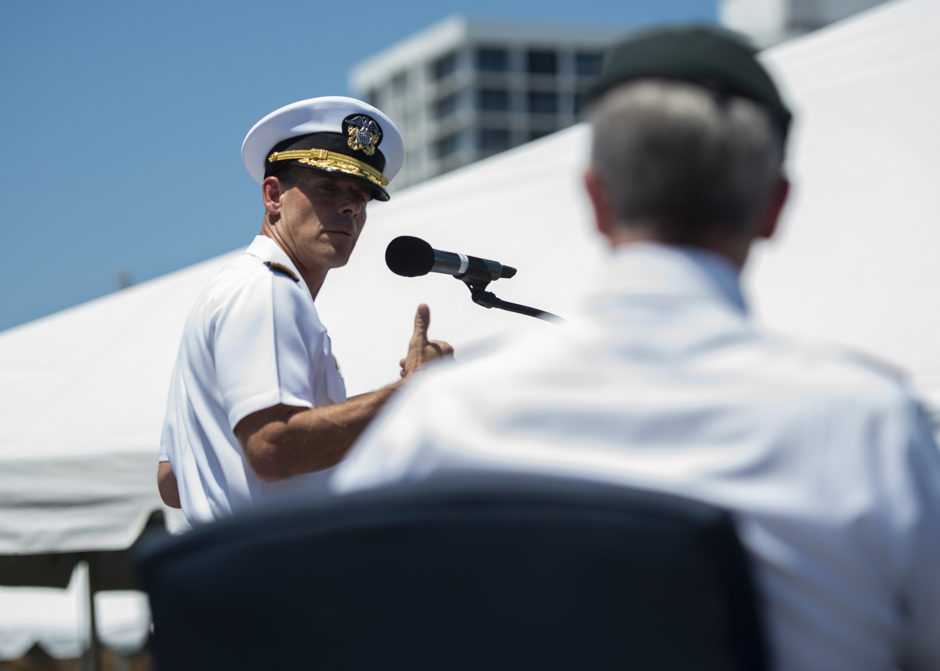 Rear Adm. Keith B. Davids, commander, Naval Special Warfare Command (NSWC), thanks Gen. Bryan P. Fenton, commander U.S. Special Operations Command, during NSWC’s change of command ceremony. NSW is the nation’s premiere maritime special operations force and is uniquely positioned to extend the fleet’s reach and deliver all-domain options for naval and joint force commanders.