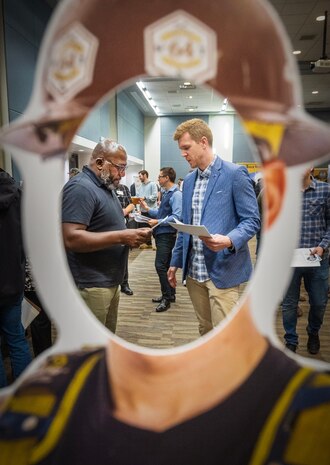 Shop Supervisor, Shop 31, Inside Machinists, looks over a résumé for Justin Armstrong, of Port Orchard, Wash., Oct. 20, 2023, during a PSNS & IMF Hiring Fair at the Kitsap Conference Center in downtown Bremerton, Washington. PSNS & IMF hopes to hire about 1,500 new employees across a variety of skills, trades and specialties, for both entry-level and journey-level, full-time Federal positions, through a two-day hiring fair, Aug. 9-10, 2024, at the Kitsap Conference Center (U.S Navy Photo by Wendy Hallmark)