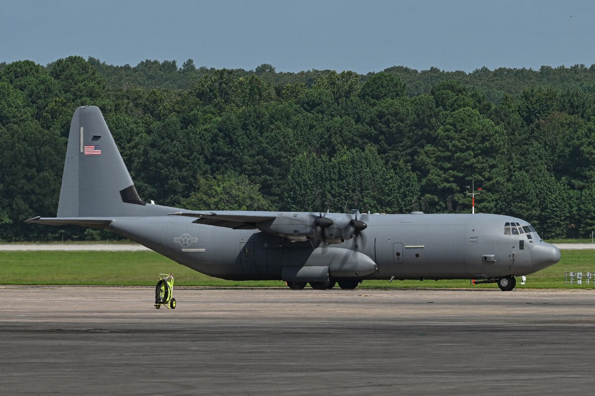 A plane sits on a runway.