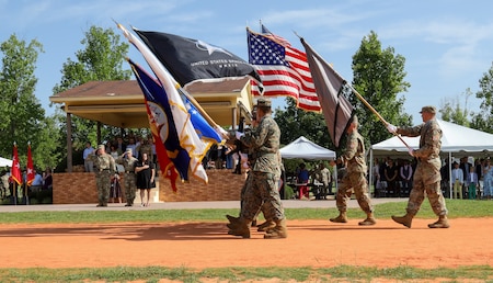 Commanding General of the Cyber Center of Excellence Maj. Gen. Ryan Janovic, former Commanding General Paul Stanton and his wife Nomi review the command during the Pass and Review at a Change of Command ceremony Aug. 2, 2024 at Barton Field on Fort Eisenhower, Ga.