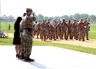 U.S. Army Cyber Center of Excellence Incoming Commanding General Maj. Gen. Ryan Janovic, Outgoing Commanding General Maj. Gen. Paul Stanton and his wife Nomi review troops during a Pass and Review at a Change of Command ceremony, Aug. 2, 2024 at Barton Field on Fort Eisenhower, Ga.