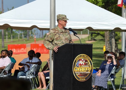 Commanding General of the U.S. Army Cyber Center of Excellence  Maj. Gen. Ryan Janovic speaks to the crowd after assuming command in a Change of Command ceremony Aug. 2, 2024, at Barton Field on Fort Eisenhower, Ga.