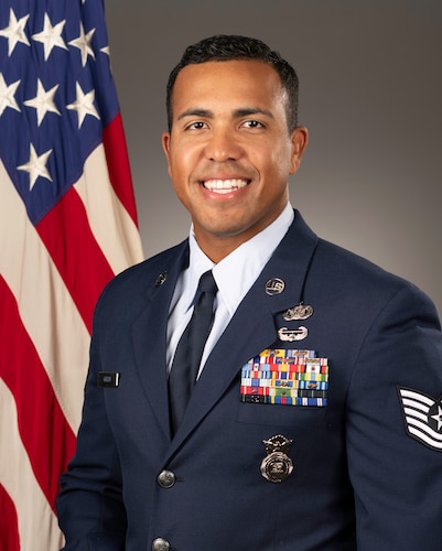 An Airman poses for his official portrait after being named one of the Outstanding Airmen of the Year.