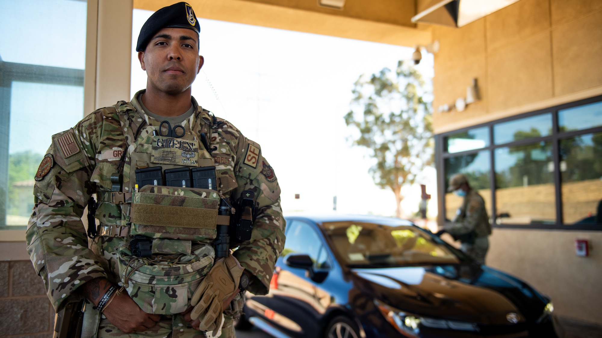 A portrait of an Airman at an entry control point