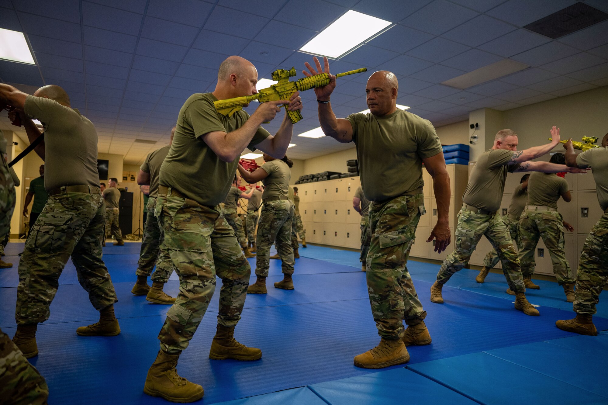 Command Chiefs from Air Mobility Command practice Krav Maga at Scott Air Force Base, Illinois, July 31, 2024. AMC and Chief Master Sgt. Jamie Newman, AMC command chief, hosted a Command Chief Symposium, driving home the importance of maintaining a warfighter’s mindset. The symposium provided chiefs with the knowledge needed to improve or create their wing's own Warrior Heart program. (U.S. Air Force photo by Rachel Sansano)