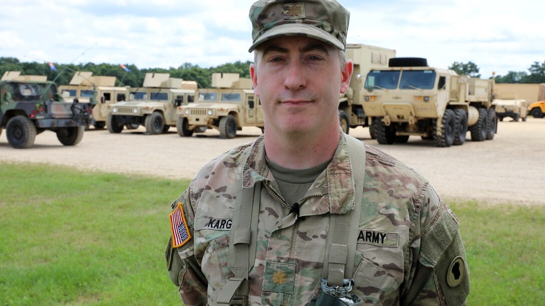 Army Maj. Herb Karg, 87th Training Division, 1st Brigade, 1st Mission Control Training Detachment, poses for a photo July 24, 2024, at a training site at Fort McCoy, Wis. Karg observed the 402nd Quartermaster Battalion serving as the unit OC/T during WAREX. (Photo by Sgt. 1st Class Justin Hardin)