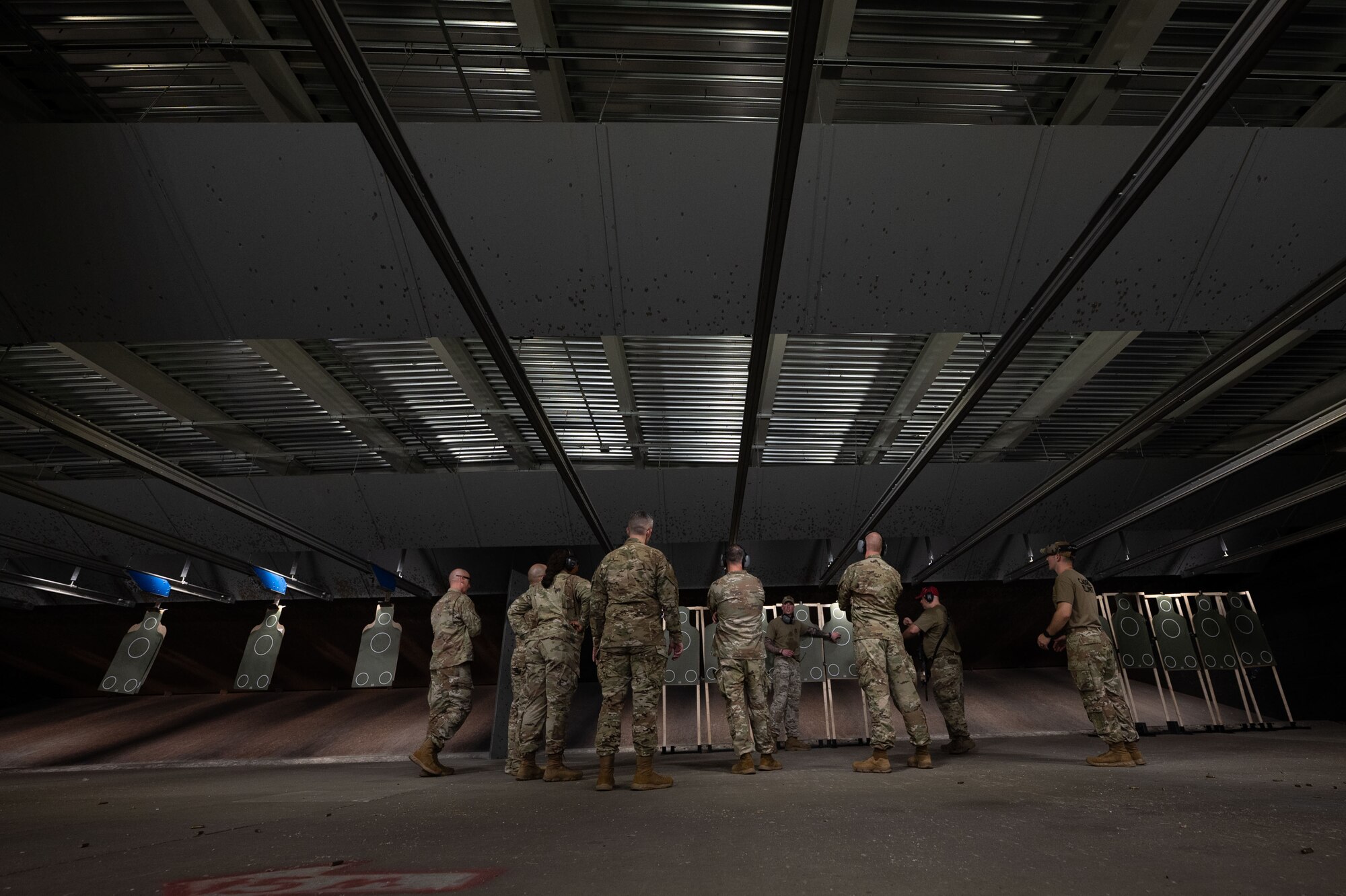 Command Chiefs from Air Mobility Command shoot live ammunition at Scott Air Force Base, Illinois, July 31, 2024. AMC and Chief Master Sgt. Jamie Newman, AMC command chief, hosted a Command Chief Symposium, driving home the importance of maintaining a warfighter’s mindset. The symposium provided chiefs with the knowledge needed to improve or create their wing's own Warrior Heart program. (U.S. Air Force photo by Rachel Sansano)