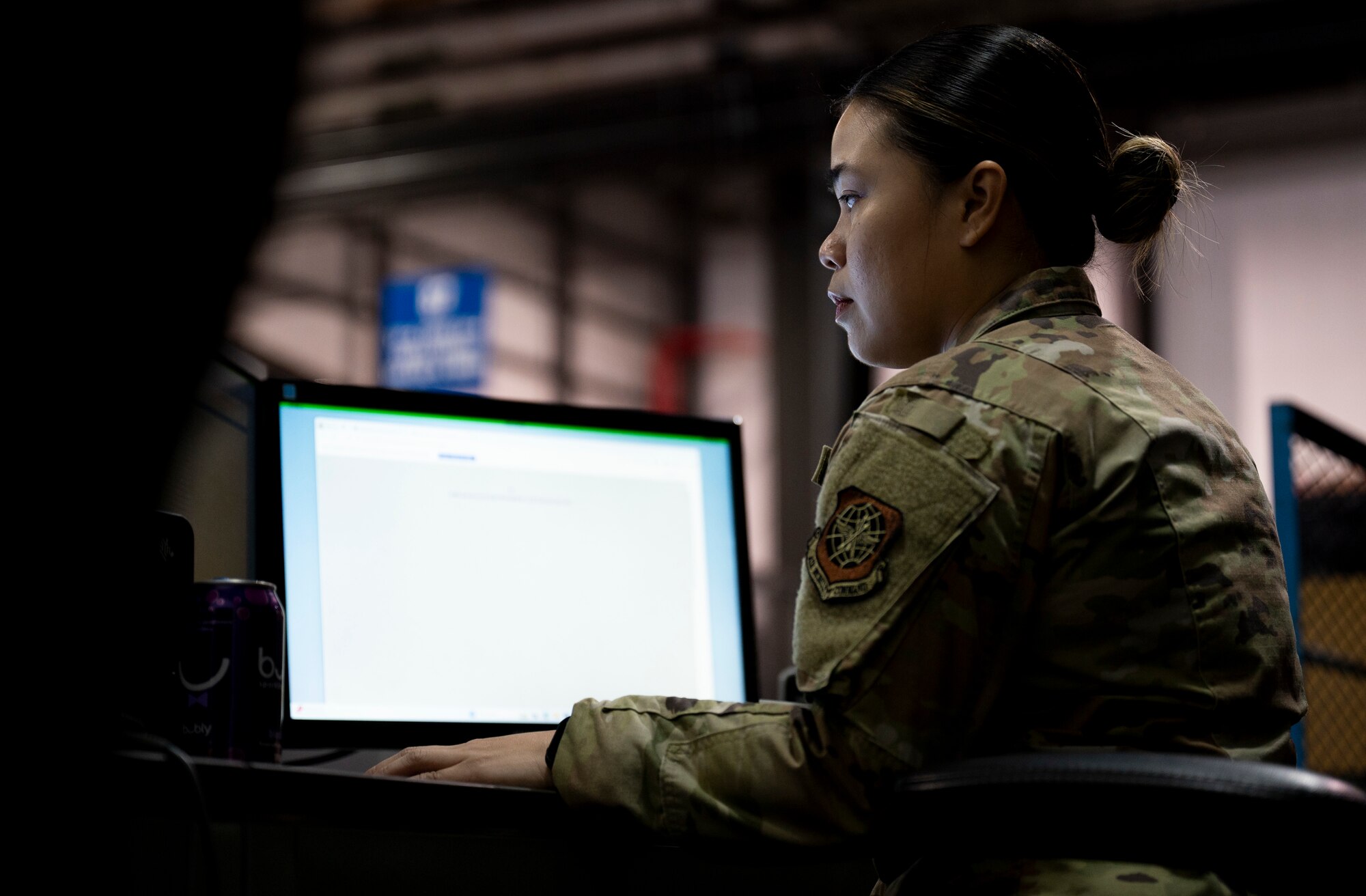 U.S. Air Force Airman 1st Class Roshelle Jandonero, 436th Aerial Port Squadron packing and crating lead, enters data into the computer at Dover Air Force Base, Delaware, July 26, 2024. Jandonero leads packing and crating for outbound cargo for the 436th APS, the largest aerial port in the Department of Defense. (U.S. Air Force photo by Airman Liberty Matthews)