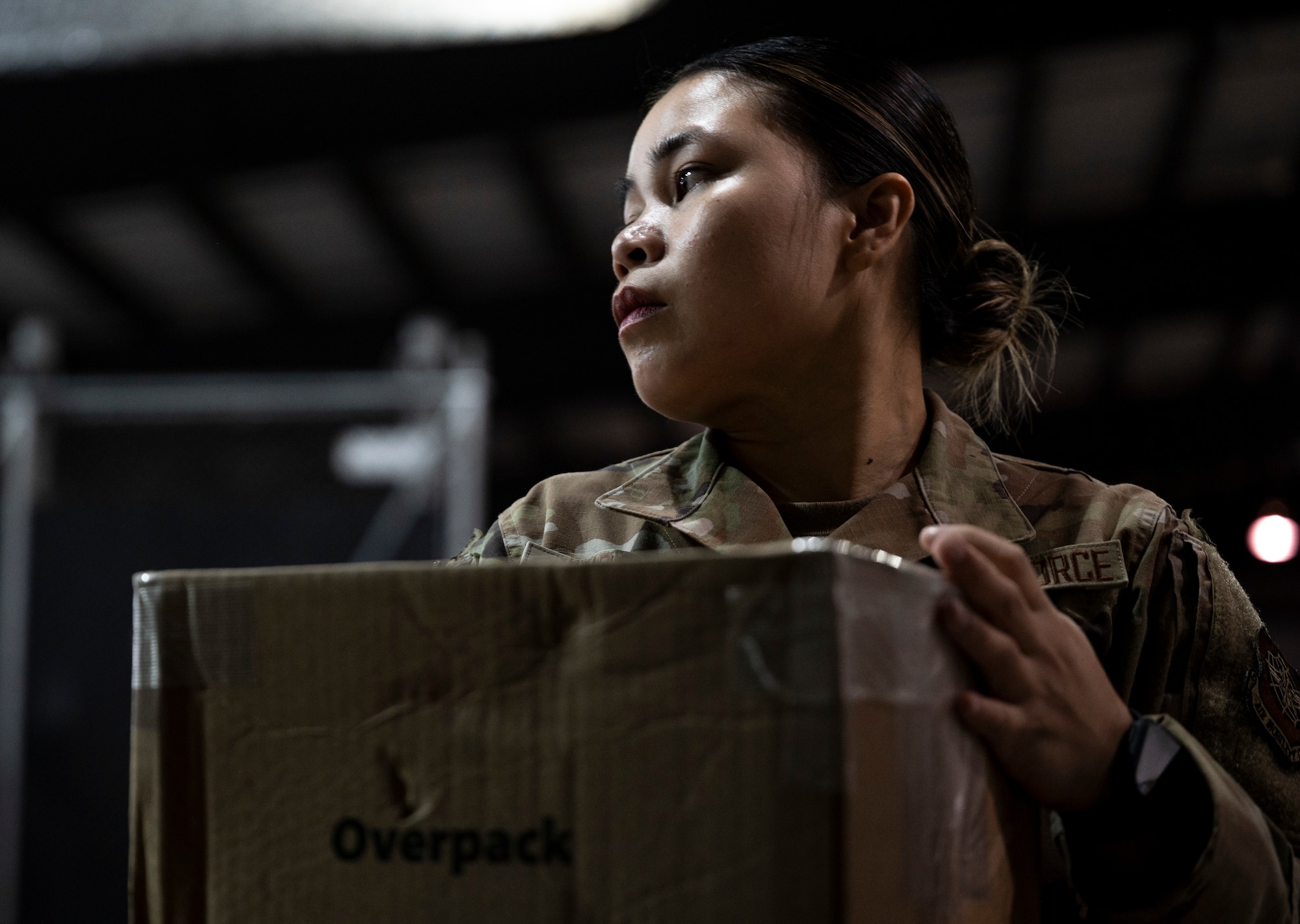 U.S. Air Force Airman 1st Class Roshelle Jandonero, 436th Aerial Port Squadron packing and crating lead, weighs a package at Dover Air Force Base, Delaware, July 26, 2024. Jandonero leads packing and crating for outbound cargo for the 436th APS, the largest aerial port in the Department of Defense. (U.S. Air Force photo by Airman Liberty Matthews)