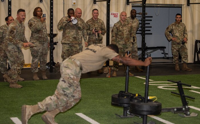Airmen cheer on teams during a physical fitness assessment at Nellis Air Force Base, Nevada, July 24, 2024.