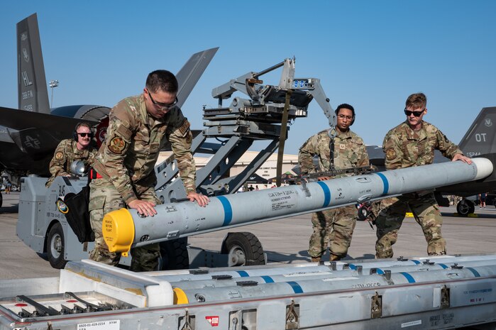U.S. Airmen assigned to the 34th Fighter Generation Squadron prepare to load a Captive Air Training Missile 120C onto an F-35A Lightning II during a load crew competition at Nellis Air Force Base, Nevada, July 26, 2024.