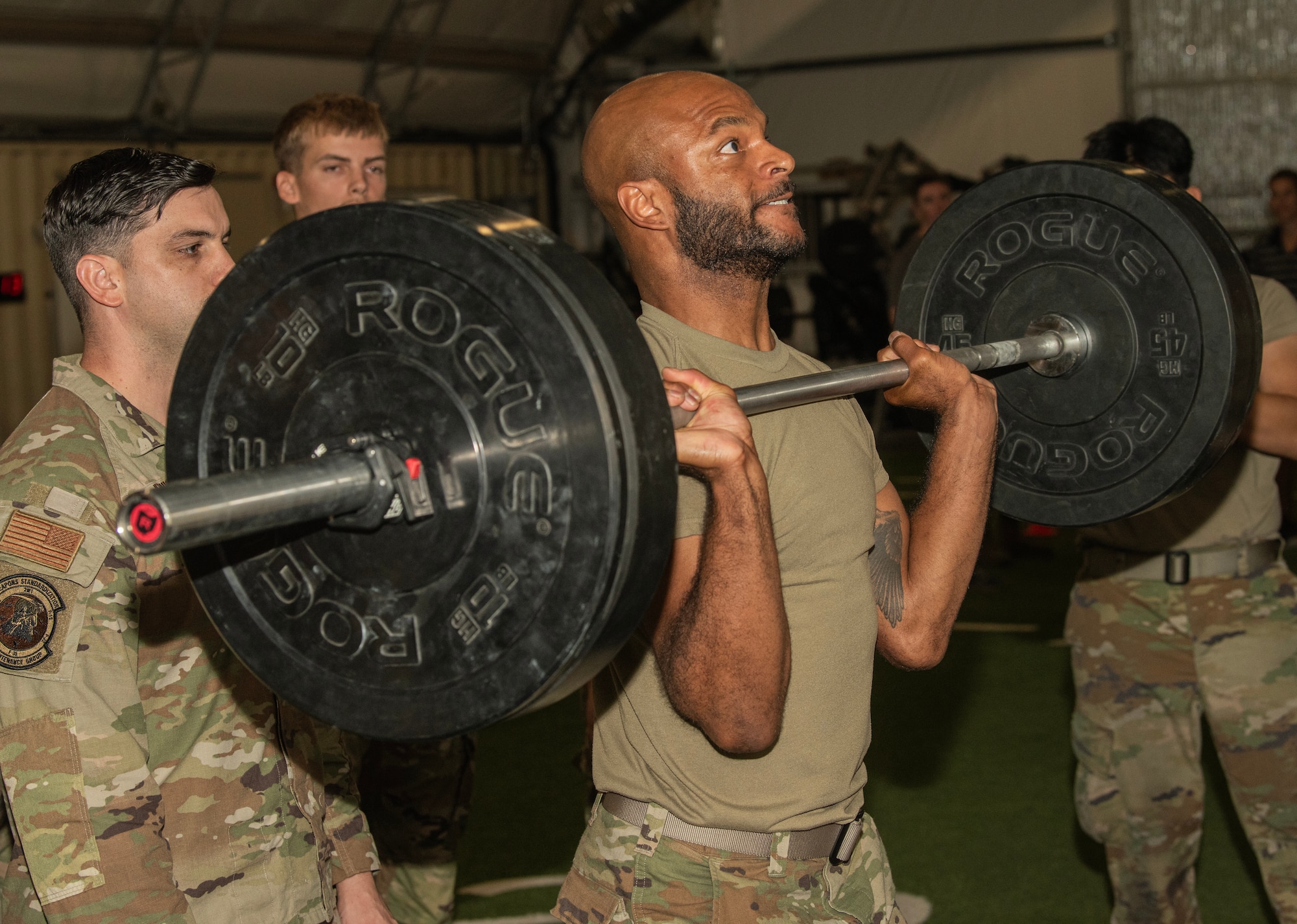 U.S. Air Force Staff Sgt. Shelton Thigpen, weapons load crew member assigned to the 94th Fighter Generation Squadron at Joint Base Langley-Eustis, Virginia, does a push press during a physical fitness assessment at Nellis Air Force Base, Nevada, July 24, 2024.