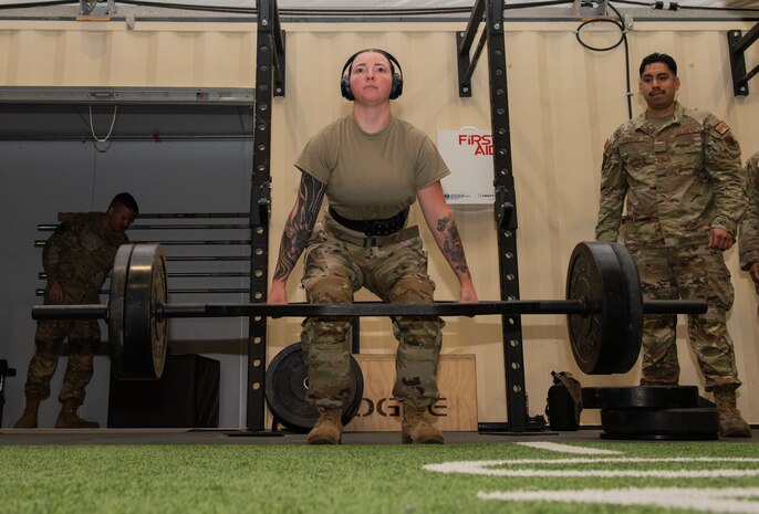 U.S. Air Force Senior Airman Laynie Jones, a weapons load crew member assigned to the 94th Fighter Generation Squadron at Joint Base Langley-Eustis, Virginia, completes a hex bar deadlift during a load crew physical fitness assessment at Nellis Air Force Base, Nevada, July 24, 2024.
