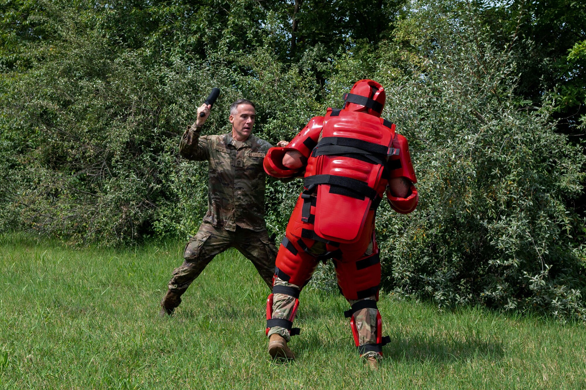 Command Chiefs from Air Mobility Command go through an obstacle course at Scott Air Force Base, Illinois, July 31, 2024. AMC and Chief Master Sgt. Jamie Newman, AMC command chief, hosted a Command Chief Symposium, driving home the importance of maintaining a warfighter’s mindset. The symposium provided chiefs with the knowledge needed to improve or create their wing's own Warrior Heart program. (U.S. Air Force photo by Rachel Sansano)