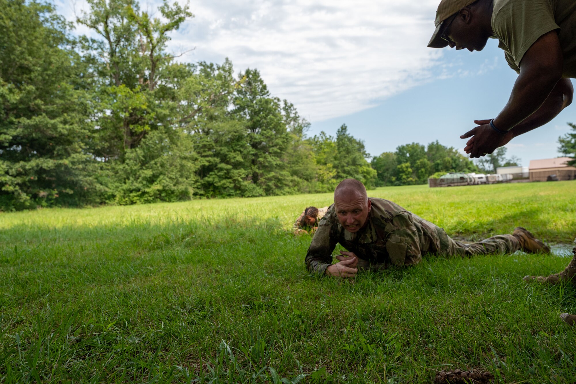 Command Chiefs from Air Mobility Command go through an obstacle course at Scott Air Force Base, Illinois, July 31, 2024. AMC and Chief Master Sgt. Jamie Newman, AMC command chief, hosted a Command Chief Symposium, driving home the importance of maintaining a warfighter’s mindset. The symposium provided chiefs with the knowledge needed to improve or create their wing's own Warrior Heart program. (U.S. Air Force photo by Rachel Sansano)