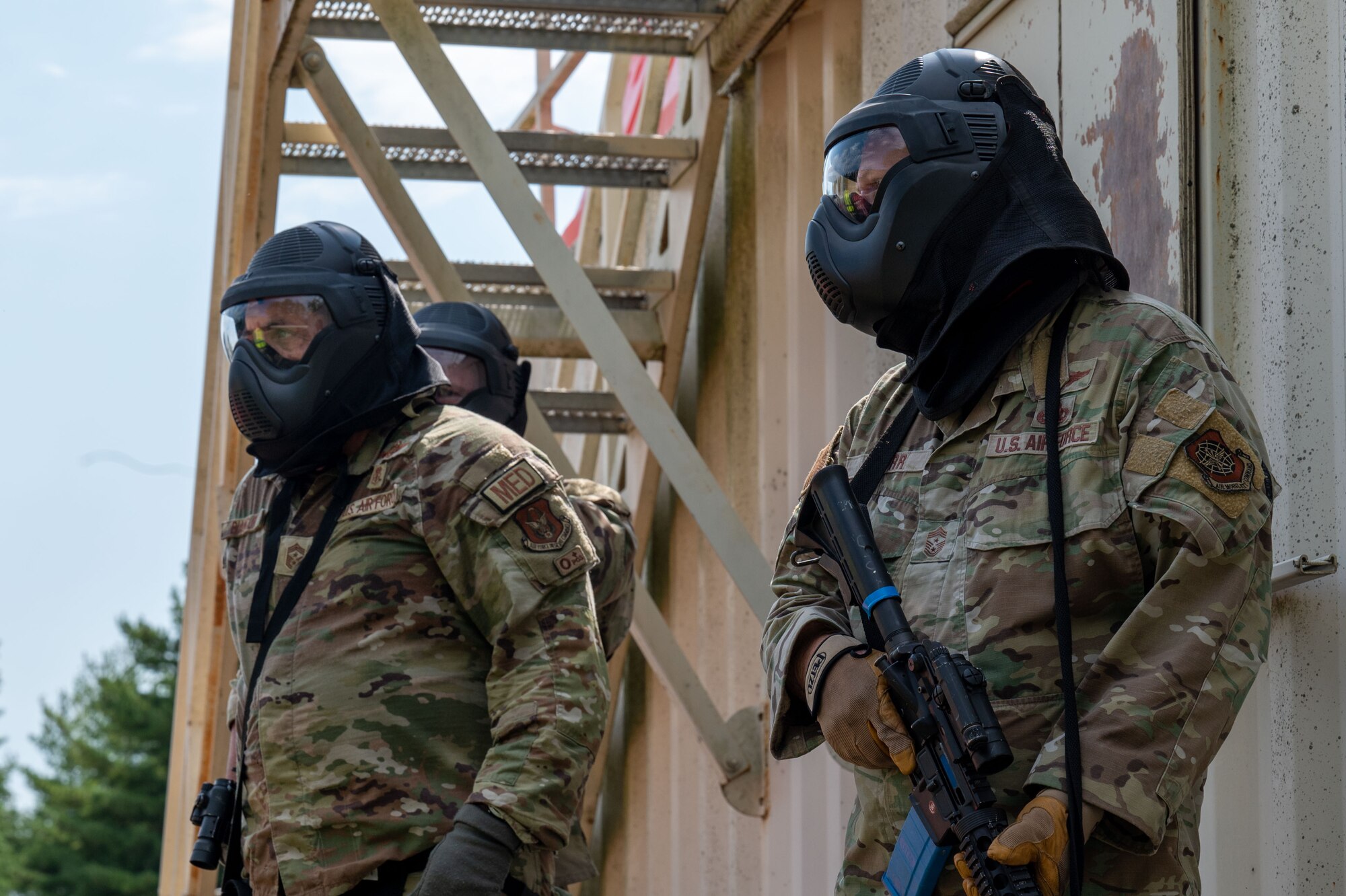 Command Chiefs from Air Mobility Command prepare to practice close quarters battle techniques at Scott Air Force Base, Illinois, July 31, 2024. AMC and Chief Master Sgt. Jamie Newman, AMC command chief, hosted a Command Chief Symposium, driving home the importance of maintaining a warfighter’s mindset. The symposium provided chiefs with the knowledge needed to improve or create their wing's own Warrior Heart program. (U.S. Air Force photo by Rachel Sansano)