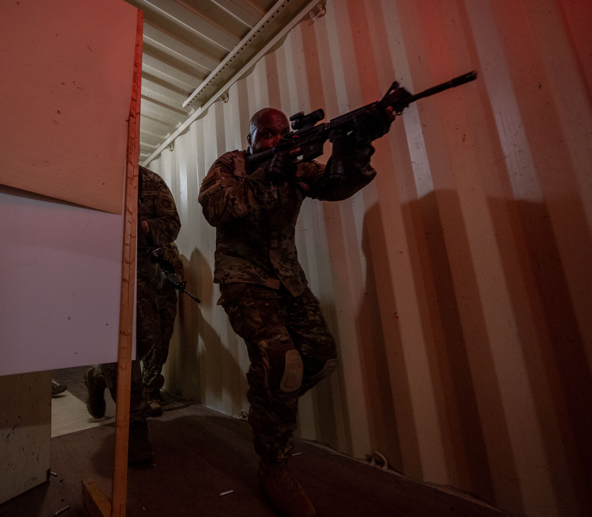 Command Chiefs from Air Mobility Command practice close quarters battle techniques at Scott Air Force Base, Illinois, July 31, 2024. AMC and Chief Master Sgt. Jamie Newman, AMC command chief, hosted a Command Chief Symposium, driving home the importance of maintaining a warfighter’s mindset. The symposium provided chiefs with the knowledge needed to improve or create their wing's own Warrior Heart program. (U.S. Air Force photo by Rachel Sansano)