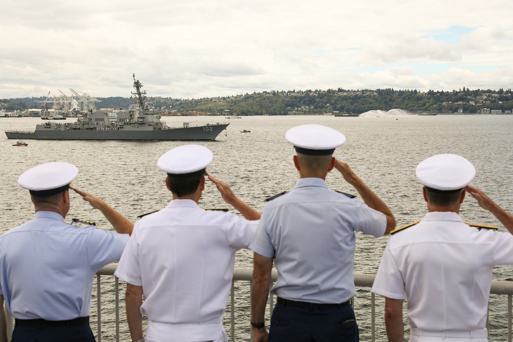 U.S. Navy, Coast Guard, and Marine Corps officers return honors to the guided missile destroyer USS Sampson (DDG 102) as part of the Parade of Ships in Elliot Bay, Washington, during Seattle Seafair Fleet Week July 30, 2024.  Seattle Fleet Week is a time-honored celebration of the sea services and provides an opportunity for the citizens of Washington to meet Sailors, Marines and Coast Guardsmen, as well as witness firsthand the latest capabilities of today’s U.S. and Canadian maritime services. (U.S. Navy photo by Mass Communication Specialist 1st Class Jacob. I. Allison)