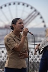 U.S. Marine Corps Lance Cpl. Eleanor Chirico, a vocalist with the 1st Marine Division Band, sings during a performance at Pike Place Market, as part of Seattle Seafair Fleet Week in Seattle, July 31, 2024. The U.S. Navy, Coast Guard, and Marines have been involved in Seafair in some way since the festival began 75 years ago. The annual event provides service members an opportunity to interact with the American people and promotes the Navy-Marine Corps team as the nation’s expeditionary force in readiness. Chirico is a native of Pennsylvania. (U.S. Marine Corps photo by Sgt. Cameron Hermanet)