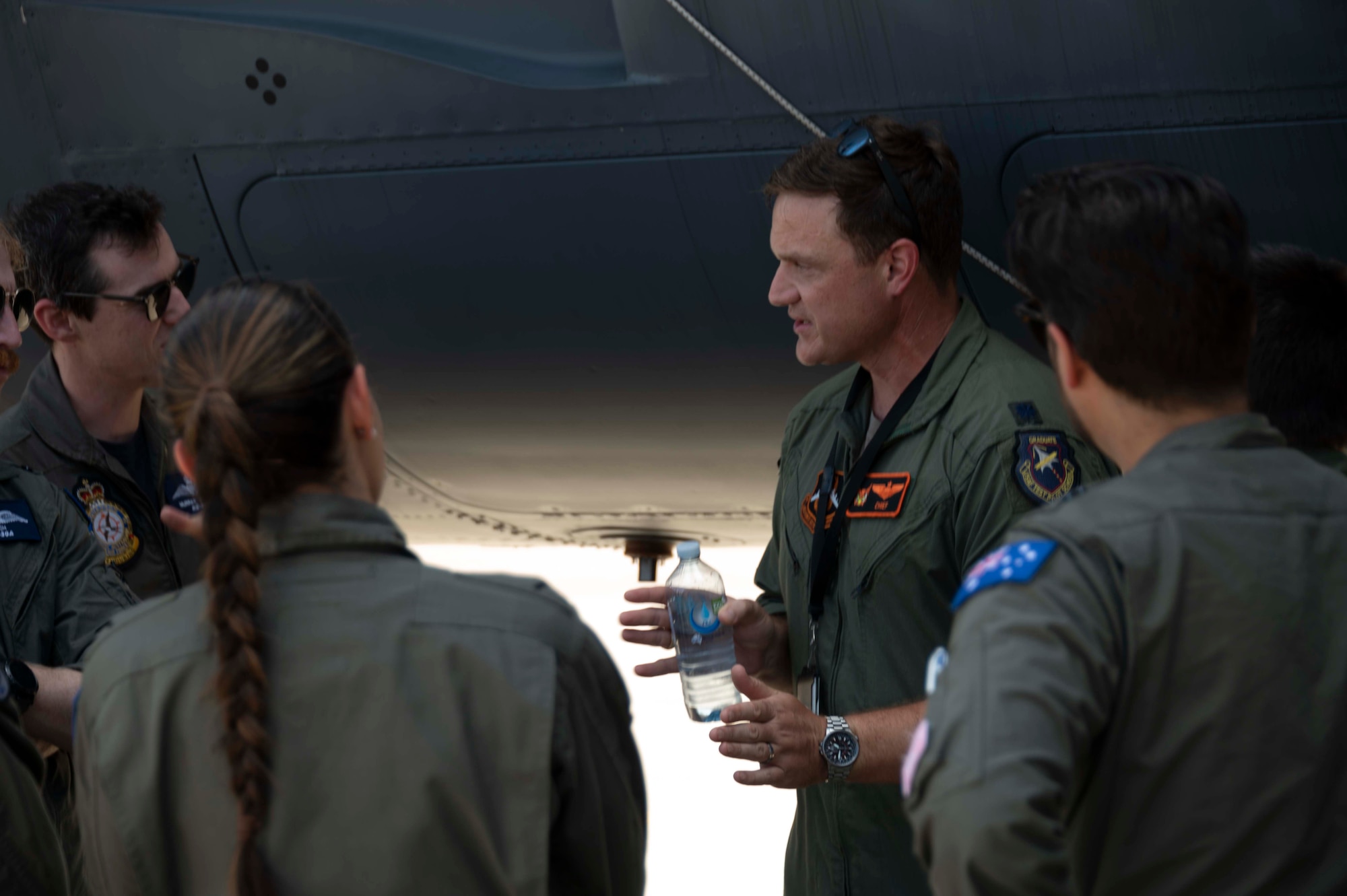 U.S. Air Force Lt. Col. Justin George, assigned to the 343rd Bomb Squadron gives Royal Austraiian Air Force personnel a B-52 Stratofortress tour at Barksdale Air Force Base, Louisiana, June 21, 2024. The tour occurred after a refueling mission between an RAAF KC-30 Multi Role Tanker Transport and a B-52 Stratofortress as part of a training mission to get U.S. Airmen certified on the tanker. The effort highlighted interoperability between the two services and helped solidify the B-52’s role in assuring allies in the Pacific region. (U.S. Air Force by Senior Master Sgt. Ted Daigle)