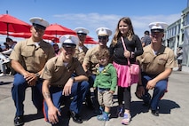 U.S. Marines with 1st Marine Division pose for a photo with locals during Seattle Seafair Fleet Week in Seattle, July 31, 2024. The U.S. Navy, Coast Guard, and Marines have been involved in Seafair in some way since the festival began 75 years ago. The annual event provides service members an opportunity to interact with the American people and promotes the Navy-Marine Corps team as the nation’s expeditionary force in readiness. (U.S. Marine Corps photo by Sgt. Cameron Hermanet)