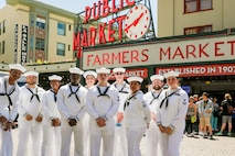 U.S. Navy Sailors from the guided missile destroyer USS Sampson (DDG 102) pose for a photo at Pike Place Market in Seattle during Seattle Seafair Fleet Week July 31, 2024.  Seattle Fleet Week is a time-honored celebration of the sea services and provides an opportunity for the citizens of Washington to meet Sailors, Marines and Coast Guardsmen, as well as witness firsthand the latest capabilities of today’s maritime services. (U.S. Navy photo by Mass Communication Specialist 1st Class Jacob I. Allison)