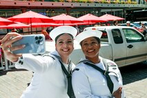 U.S. Navy Sailors from the guided missile destroyer USS Sampson (DDG 102) take a selfie at Pike Place Market in Seattle during Seattle Seafair Fleet Week July 31, 2024.  Seattle Fleet Week is a time-honored celebration of the sea services and provides an opportunity for the citizens of Washington to meet Sailors, Marines and Coast Guardsmen, as well as witness firsthand the latest capabilities of today’s maritime services. (U.S. Navy photo by Mass Communication Specialist 1st Class Jacob I. Allison)