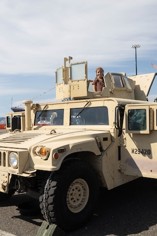 A child poses for a photo in the turret of a U.S. Marine Corps Humvee at a static display of weapons and equipment during Seattle Seafair Fleet Week in Seattle, Aug. 1, 2024. The U.S. Navy, Coast Guard, and Marines have been involved in Seafair in some way since the festival began 75 years ago. The annual event provides service members an opportunity to interact with the American people and promotes the Navy-Marine Corps team as the nation’s expeditionary force in readiness. (U.S. Marine Corps photo by Sgt. Cameron Hermanet)