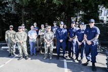 U.S. Navy Sailors, Marines, and Coast Guardsman pose for a group photo with employees during a community event at Seattle Children's Hospital in Seattle as part of Seattle Seafair Fleet Week Aug. 1, 2024.  Seattle Fleet Week is a time-honored celebration of the sea services and provides an opportunity for the citizens of Washington to meet Sailors, Marines and Coast Guardsmen, as well as witness firsthand the latest capabilities of today’s maritime services. (U.S. Navy photo by Mass Communication Specialist 1st Class Jacob I. Allison)