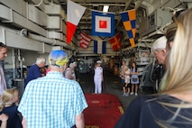 U.S. Navy Chief Warrant Officer 2 Jenny Lam, a Sailor aboard the guided missile destroyer USS Sampson (DDG 102) leads a tour for visitors aboard USS Sampson during Seattle Seafair Fleet Week Aug. 2, 2024.  Seattle Fleet Week is a time-honored celebration of the sea services and provides an opportunity for the citizens of Washington to meet Sailors, Marines and Coast Guardsmen, as well as witness firsthand the latest capabilities of today’s maritime services. (U.S. Navy photo by Mass Communication Specialist 1st Class Jacob I. Allison)