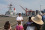 U.S. Navy Senior Chief Information System Technician Kala Lopes, a Sailor aboard the guided missile destroyer USS Sampson (DDG 102) leads a tour for visitors aboard USS Sampson during Seattle Seafair Fleet Week Aug. 2, 2024.  Seattle Fleet Week is a time-honored celebration of the sea services and provides an opportunity for the citizens of Washington to meet Sailors, Marines and Coast Guardsmen, as well as witness firsthand the latest capabilities of today’s maritime services. (U.S. Navy photo by Mass Communication Specialist 1st Class Jacob I. Allison)