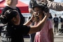 U.S. Marine Corps Sgt. Alexia Sawyers, left, a recruiter with Recruiting Station Seattle, 12th Marine Corps District, places an enhanced combat helmet on a girl at a static display of weapons and equipment during Seattle Seafair Fleet Week in Seattle, Aug. 3, 2024. The U.S. Navy, Coast Guard, and Marines have been involved in Seafair in some way since the festival began 75 years ago. The annual event provides service members an opportunity to interact with the American people and promotes the Navy-Marine Corps team as the nation’s expeditionary force in readiness. Sawyers is a native of Arizona. (U.S. Marine Corps photo by Sgt. Cameron Hermanet)