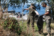 U.S. Marine Corps Sgt. Kham Siam and Corparal Tristan Sherry pick up trash at Myrtle Edwards Park for Seattle Fleet Week Aug. 3, 2024. Seattle Fleet Week is a time-honored celebration of the sea services and provides an opportunity for the citizens of Washington to meet Sailors, Marines and Coast Guardsmen, as well as witness firsthand the latest capabilities of today’s maritime services. (U.S. Navy photo by Mass Communication Specialist 3rd Class Justin Ontiveros)