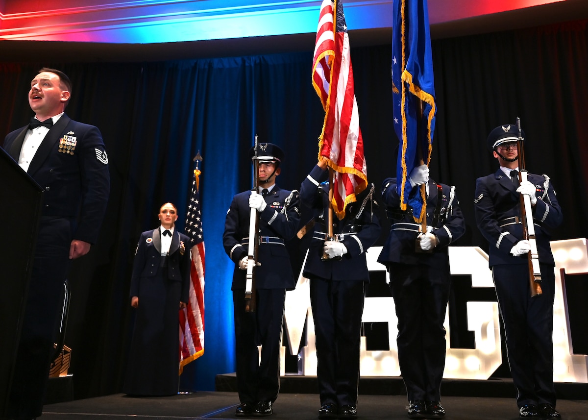 U.S. Airmen assigned to Davis-Monthan Air Force Base Honor Guard present the colors during a senior noncommissioned officer induction ceremony in Tucson, Ariz., Aug. 2, 2024. The colors, or flags, are posted at a military ceremony marking an anniversary or significant event. (U.S. Air Force photo by Staff Sgt. Abbey Rieves)