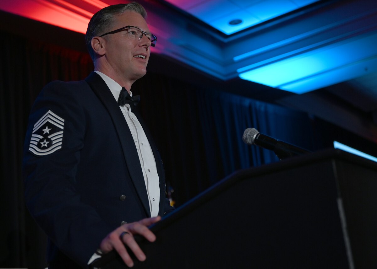 U.S. Air Force Chief Master Sgt. Michael Becker, 355th Wing command chief, speaks at the senior noncommissioned officer induction ceremony in Tucson, Ariz., Aug. 2, 2024. Becker charged the inductees as SNCOs and provided words of wisdom. (U.S. Air Force photo by Staff Sgt. Abbey Rieves)