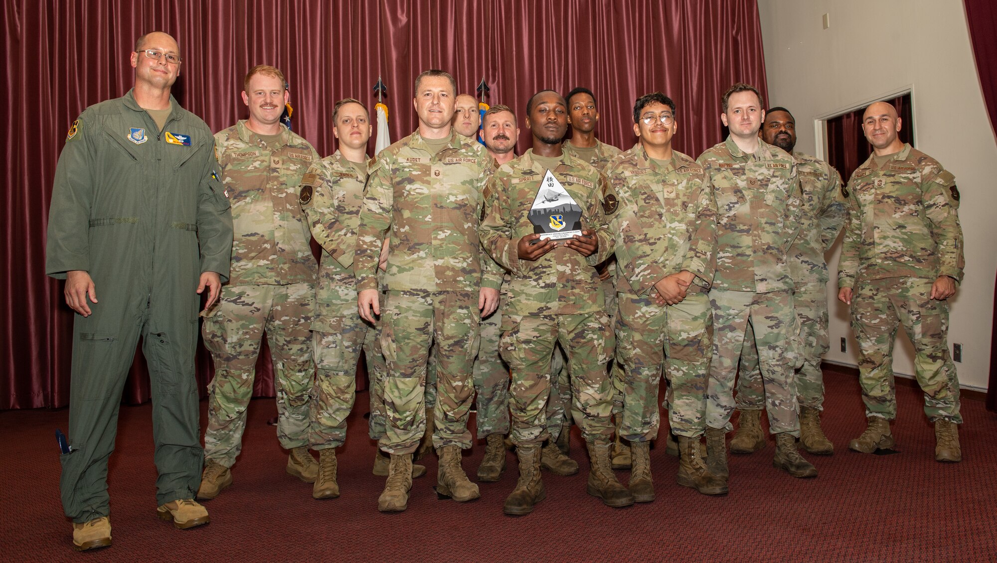 U.S. Air Force 374th Airlift Wing leadership presents an award to the aerospace ground equipment flight at Yokota Air Base, Japan.